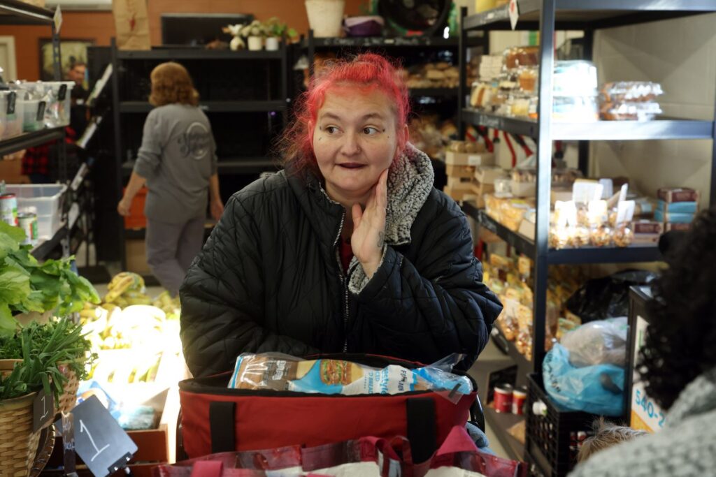 Carissa, a guest at River City Bread Basket, browses isles of food.